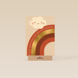 Regenboog met een lachend wolkje
