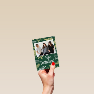 kerst zakelijk fotokaart met bladeren op groen