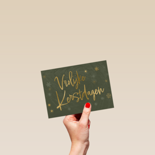 kerstkaart met gouden tekst op groene achtergrond