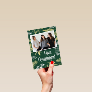 kerst zakelijk fotokaart met bladeren op groen
